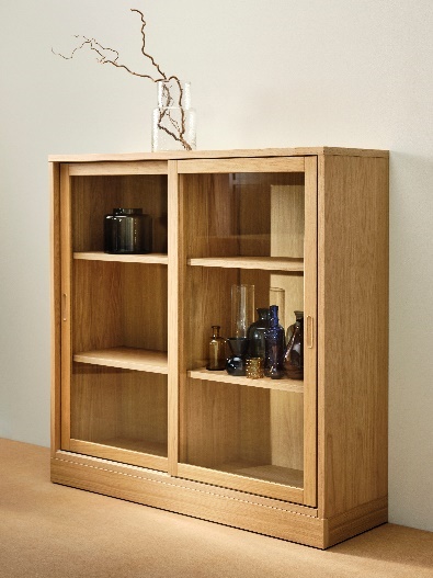 A wooden cabinet with glass shelves Description automatically generated