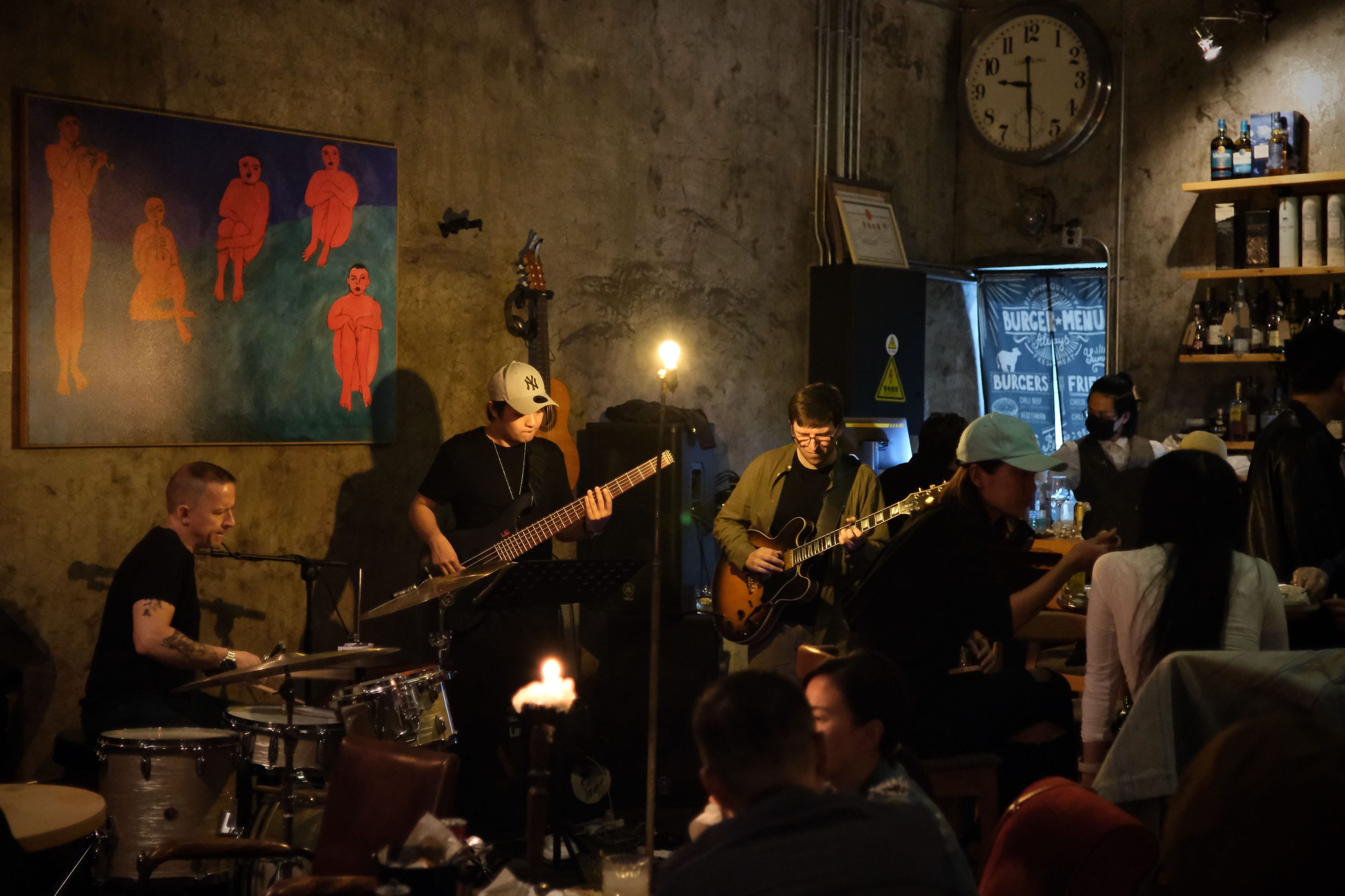 A group of people playing instruments

AI-generated content may be incorrect.