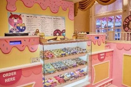 A display case with donuts on it

AI-generated content may be incorrect.